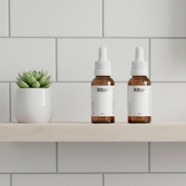 HR23+ capsules in a hand